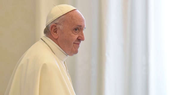 Pope Francis stands during the audience with Ecuador's President Lenin Moreno at the Vatican, Saturday, Dec. 16, 2017.
