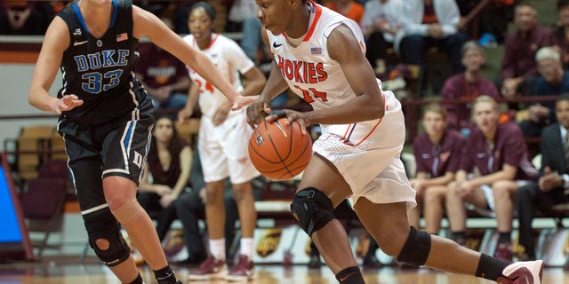 Duke's Haley Peters, left, guards Virginia Tech's Uju Ugoka, right, during the second half of an NCAA college basketball game on Sunday, Jan. 19, 2014, in Blacksburg, Va. Duke won 74-70. (AP Photo/Don Petersen)