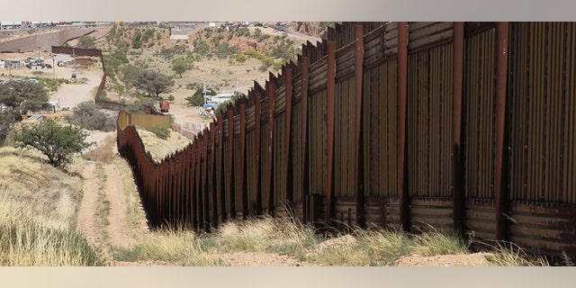 NOGALES, AZ - JUNE 02: A fence separates the cities of Nogales, Arizona (L) and Nogales, Sonora Mexico, a frequent crossing point for people entering the United States illegally, June 2, 2010 in Nogales, Arizona. During the 2009 fiscal year 540,865 undocumented immigrants were apprehended entering the United States illegally along the Mexican border, 241,000 of those were captured in the 262 mile stretch of the border known as the Tucson Sector. (Photo by Scott Olson/Getty Images)