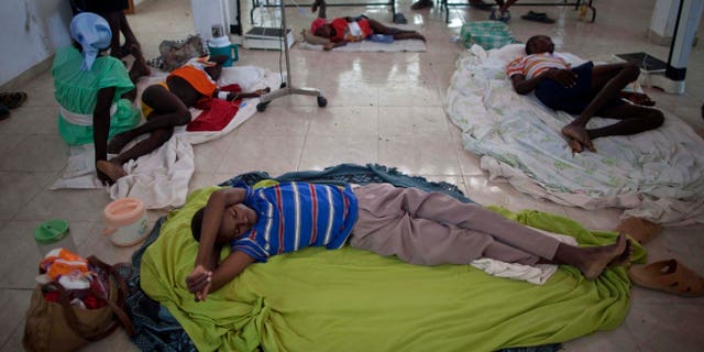 Nov. 10: People suffering cholera symptoms rest in a hospital in Grande-Saline, Haiti.