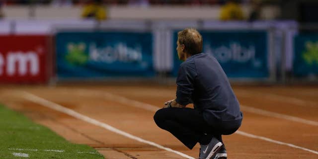 United States coach Jurgen Klinsmann watches the game on the sideline during a 2018 World Cup qualifying soccer match against Costa Rica, in San Jose, Costa Rica, Tuesday, Nov. 15, 2016. United States lost 4-0 to Costa Rica. (AP Photo/Moises Castillo)