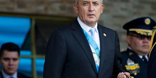 FILE - In this June 30, 2015, file photo, Guatemala's President Otto Perez Molina arrives to the Army general headquarters for the Army Day parade in Guatemala City. An attempt to withdraw Perez Molina's immunity from prosecution died in Congress on Thursday, Aug. 13, 2015, following a string of corruption scandals that sparked large protests. (AP Photo/Moises Castillo, File)