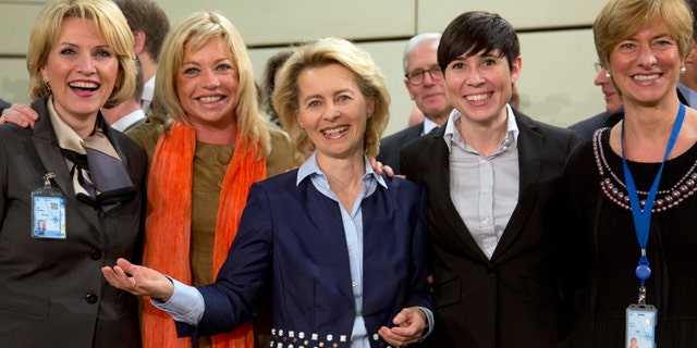 From left, defense ministers, Albania's Mimi Kodheli, Netherland's Jeanine Hennis-Plasschaert, Germany's Ursula von der Leyen, Norway's Ine Marie Eriksen Soreide and Italy's Roberta Pinotti pose for photographers prior to the start of a meeting of defense ministers of the North Atlantic Council at NATO headquarters in Brussels on Wednesday, Feb. 26, 2014. Frustrated with his Afghan counterpart, U.S. President Barack Obama is ordering the Pentagon to accelerate planning for a full U.S. troop withdrawal from Afghanistan by the end of this year. But Obama is also holding out hope that Afghanistan's next president may eventually sign a stalled security agreement that could prevent the U.S. from having to take that step. (AP Photo/Virginia Mayo)