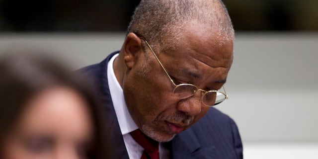 April 26: Former Liberian President Charles Taylor looks down as he waits for the start of a hearing to deliver verdict in the court room of the Special Court for Sierra Leone in Leidschendam, near The Hague, Netherlands.