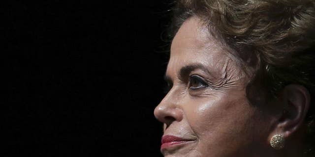 Brazil's President Dilma Rousseff attends the opening of the National Conference of Women, in Brasilia, Brazil, Tuesday, May 10, 2016. The impeachment proceedings against Rousseff took another hairpin turn Tuesday after the acting speaker of Congress' lower house Waldir Maranhao put the impeachment process back on track a day after he sparked chaos and sowed further discord among Brazil's fractious political class by annulling an April 17 vote by the Chamber of Deputies for impeachment. (AP Photo/Eraldo Peres)