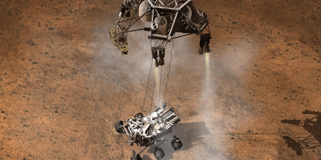 This artist's concept depicts the moment that NASA's Curiosity rover touches down onto the Martian surface.