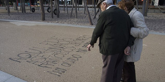 Graffiti reading, "Here Francisco Romero was killed. I don't forget; I don't forgive." (Photo: AP)