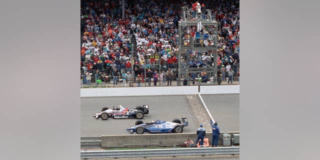 Al Unser Jr., top, edged out Scott Goodyear to win his first Indianapolis 500 in 1992. (AP Photo/David Boe, File)