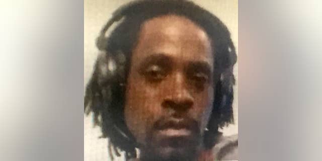 This undated photo provided by the Fresno Police Department shows Kori Ali Muhammad, 39, who was arrested shortly after a shooting rampage outside a Catholic Charities building, in Fresno, Calif, on Tuesday, April 18, 2017.