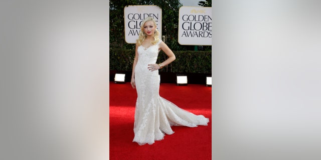 Francesca Eastwood, Miss Golden Globe 2013, poses as she arrives at the 70th annual Golden Globe Awards in Beverly Hills, California, January 13, 2013.