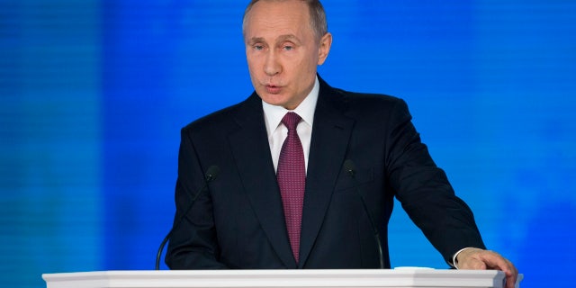 Russian President Vladimir Putin gives his annual state of the nation address in Manezh in Moscow, Russia, Thursday, March 1, 2018.