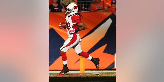 Arizona Cardinals running back Andre Ellington (38) scores a touchdown against the Denver Broncos during the second half of an NFL football game, Sunday, Oct. 5, 2014, in Denver. (AP Photo/Jack Dempsey)