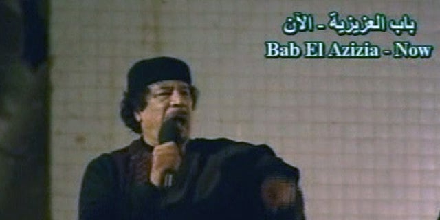 March 22: In this image taken from Libyan State TV, Libyan leader Muammar Qaddafi talks to a large crowd in Bab El Azizia, Libya. (AP)