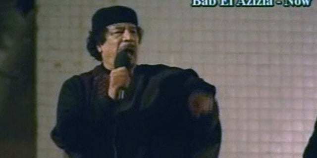 March 22: In this image taken from Libyan State TV, Libyan leader Muammar Qaddafi talks to a large crowd in Bab El Azizia, Libya. (AP)