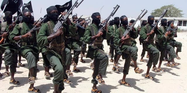 Hundreds of newly trained al-Shabab fighters perform military exercises in the Lafofe area some 18 kilometers south of Mogadishu, in Somalia.