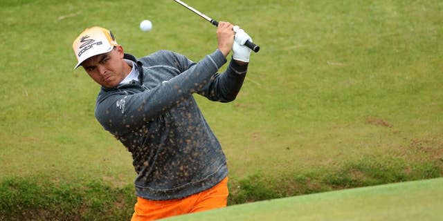Rickie Fowler of the United States play out of a bunker on the 8th green during the final round of the British Open Golf Championship at the Royal Troon Golf Club in Troon, Scotland, Sunday, July 17, 2016. (AP Photo/Peter Morrison)
