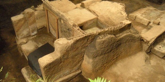 An excavated household (left), storehouse (center) and community sauna (upper right) buried by volcanic ash at Cerén around A.D. 660.