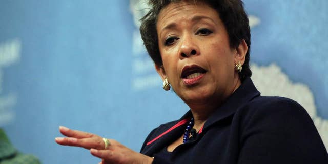 United States Attorney General Loretta Lynch gestures as she answers a question from the audience after speaking at Chatham House, The Royal Institute for International Affairs, in London, Wednesday, Dec. 9, 2015. (AP Photo/Alastair Grant)