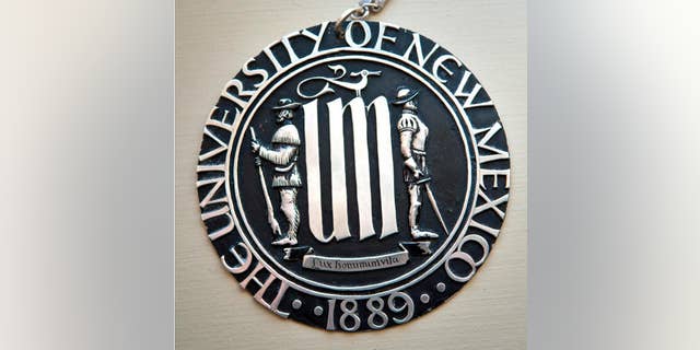 This undated photo shows the University of New Mexico's official seal, depicting a Spanish conquistador and a frontiersman, that is drawing accusations of racism from Native American students. New Mexico's largest university is considering revising its half-century old seal over concerns by Native American students who say it represents the frontier's violent era.
(Marla Brose/Albuquerque Journal via AP