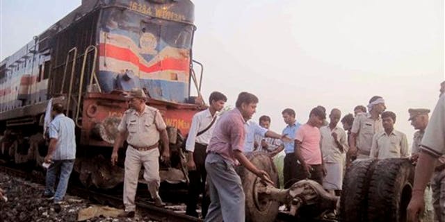 July 07: Volunteers help look for survivors and clear debris after a deadly collision between a train and a bus left 35 dead.