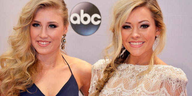 Maddie Marlow (L) and Tae Dye of the duo Maddie and Tae arrive at the 48th Country Music Association Awards in Nashville, Tennessee November 5, 2014.