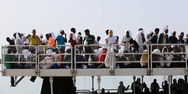 May 5, 2015: Migrants wait to disembark from the ' The Phoenix ' a Malta-based Migrant Offshore Aid Station, in the Sicilian harbor of Pozzallo, Italy. More than 350 migrants were on the Maltese-registered ship that brought them to safety, according to Doctors Without Borders who are helping with the rescue effort.