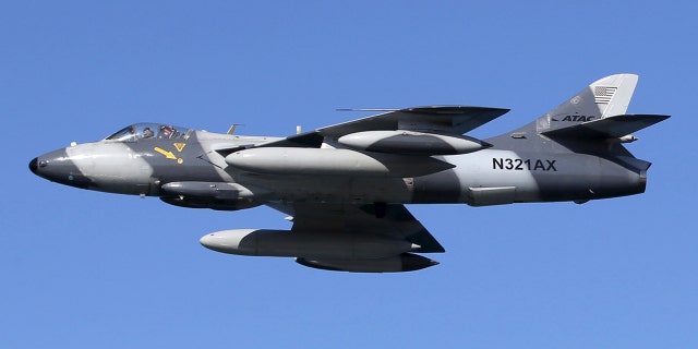A U.S. military MK-58 Hawker Hunter fighter jet flies over U.S. and Philippine troops during assault exercises at a Philippine naval base San Antonio, Zambales, Oct. 9, 2015.