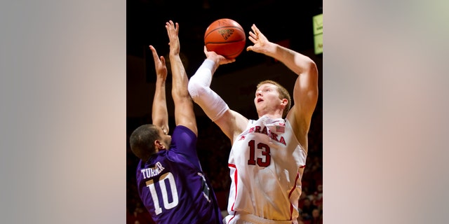 Nebraska's Brandon Ubel (13) shoots over Northwestern's Mike Turner (10) during the first half of their NCAA college basketball game, Saturday, Jan. 26, 2013, in Lincoln, Neb. (AP Photo/The Journal-Star, Matt Ryerson) LOCAL TV OUT; KOLN-TV OUT; KGIN-TV OUT; KLKN-TV OUT