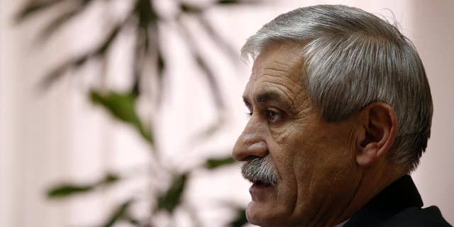 The head of a Serbian arms factory Milojko Brzakovic speaks during an interview with The Associated Press, in Belgrade, Serbia, Thursday, Dec. 10, 2015. Brzakovic of the Zastava arms factory told the Associated Press Thursday that the M92 semi-automatic pistol was traced after its serial number matched the one delivered to an American arms dealer in May 2013. (AP Photo/Darko Vojinovic)