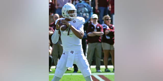 Texas A&M quarterback Kenny Hill (7) prepares throw a pass during the first half of an NCAA college football game against Mississippi State in Starkville, Miss., Saturday, Oct. 4, 2014. (AP Photo/Jim Lytle)