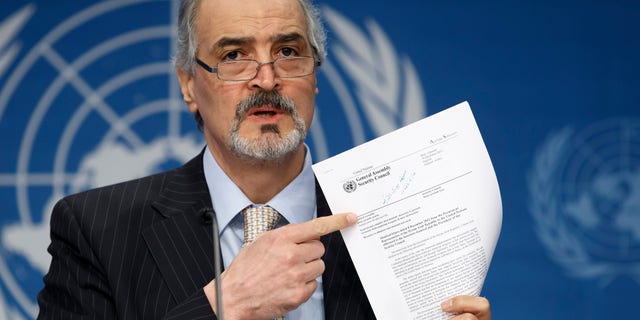 Syrian Ambassador to the United Nations, Bashar Ja'afari, points to a document during a press conference during the Syrian peace talks in Montreux, Switzerland, Wednesday, Jan. 22, 2014. U.N. Secretary-General Ban Ki-moon opened the meeting saying that the peace talks will face "formidable" challenges for Syria. Ban called on the Syrian government and the opposition trying to overthrow it to negotiate in good faith.(AP Photo/KEYSTONE/Salvatore Di Nolfi)