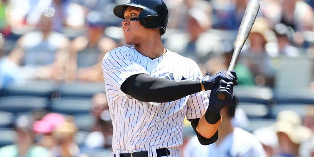 NEW YORK, NY - JUNE 11: Aaron Judge #99 of the New York Yankees singles to right field in the first inning against the Baltimore Orioles at Yankee Stadium on June 11, 2017 in the Bronx borough of New York City. (Photo by Mike Stobe/Getty Images)