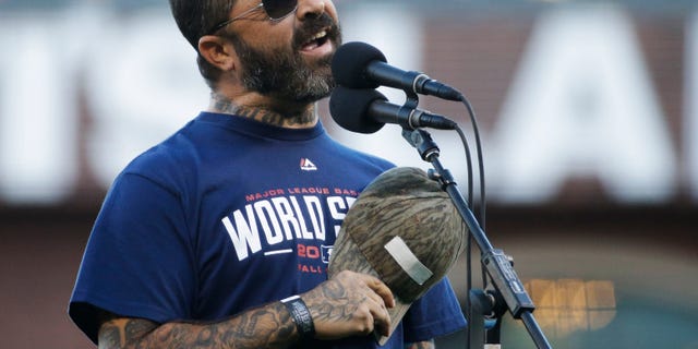 Recording artist Aaron Lewis performs the national anthem before Game 5 of baseball's World Series between the Kansas City Royals and the San Francisco Giants Sunday, Oct. 26, 2014, in San Francisco. (AP Photo/Matt Slocum)