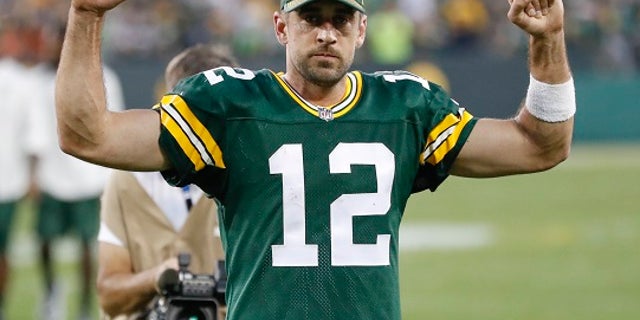 Green Bay Packers' Aaron Rodgers celebrates after an NFL football game against the Cincinnati Bengals Sunday, Sept. 24, 2017, in Green Bay, Wis. The Packers won 27-24 in overtime. (AP Photo/Matt Ludtke)