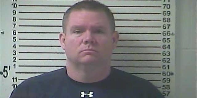 This Oct. 13, 2016 booking image released by the Hardin County Detention Center, shows Stephen Kyle Goodlett, the former principal of LaRue County,Ky. High School. Goodlett, of Elizabethtown, Ky., was indicted Wednesday, Jan. 5, 2017, in Louisville on federal charges of possessing and transporting child pornography, news outlets reported. He admitted to seizing students’ phones so that he could steal pornographic images from them and trade them online, investigators said. He was fired after his arrest in October. (Hardin County Detention Center via AP)
