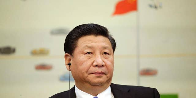 Chinas President Xi Jinping attends a meeting of the second Understanding China Conference, in Beijing, China, Tuesday, Nov. 3, 2015. President Xi Jinping said Tuesday that China needs at least 6.5 percent economic growth in coming years and the Communist Party announced plans to let its tightly controlled yuan trade freely by 2020. (Jason Lee/Pool Photo via AP)
