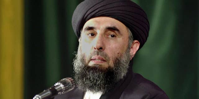 In this Wednesday, Oct. 3, 2001 file photo, Gulbuddin Hekmatyar, the leader of Afghanistan's Hezb-i-Islami speaks at the Tehran University in Iran. The only insurgent leader to sign a peace pact with Afghanistan’s government will return to the country within weeks, his chief negotiator says, in a move that could shake up Afghan politics and complicate the much wider war against the Taliban. Hekmatyar, a former warlord who battled U.S. forces after the 2001 invasion and nursed a bitter rivalry with other Afghan factions, agreed to lay down arms last year. (AP Photo/Kamran Jebreili, File)