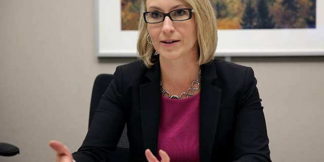 In this Tuesday, Aug. 19, 2014 photo, Keri Gohman of Capital One Financial speaks during an interview with The Associated Press in New York. Gohman says small business owners are reporting better earnings and are reinvesting in their businesses and that’s translating into a rebound in loan demand. (AP Photo/Peter Morgan)