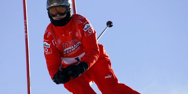 FILE - In this Friday, Jan. 13, 2006 file photo, Ferrari driver Michael Schumacher of Germany speeds down a course in Madonna di Campiglio, Italy. Schumacher is in this Italian Alps ski resort for the yearly meeting between Ferrari drivers and the press. French radio says retired Formula One champion Michael Schumacher has been injured in a skiing accident. RMC radio reported Sunday Dec. 29, 2013 that the seven-time champion had fallen while skiing off-piste at the French Alpine resort of Meribel. The radio quoted resort director Christophe Gernigon-Lecomte as saying that Schumacher was wearing a helmet when he fell and hit a rock. (AP Photo/Luca Bruno, File)