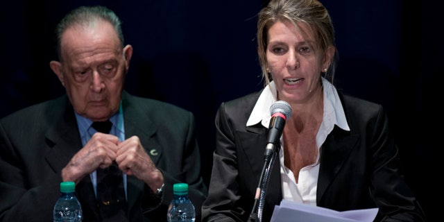 Sandra Arroyo Salgado and forensic doctor Osvaldo Raffo, in Buenos Aires, Argentina, Thursday, March 5, 2015.