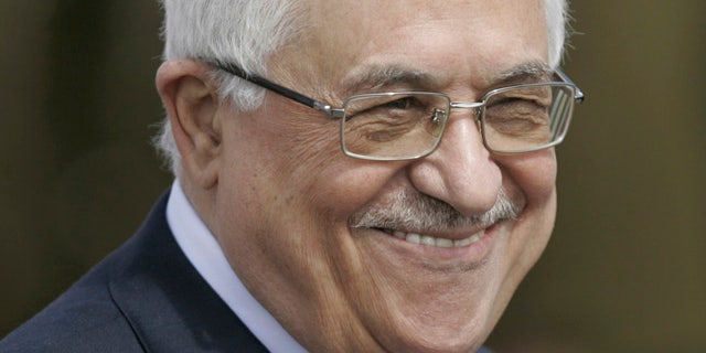 March 5: Palestinian President Mahmoud Abbas, reacts, as he walks with Chile's President Sebastian Pinera, not seen, after reviewing an honor guard, in the West Bank city of Ramallah. (AP)