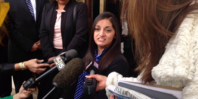 April "Abby" Guerra speaks to reporters in Phoenix Friday, May 8, 2015.