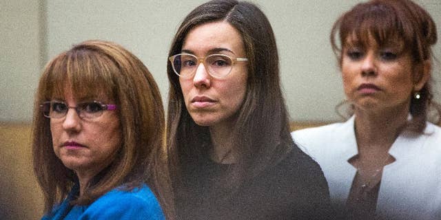FILE - Convicted murderer Jodi Arias, center, watches the jury enter the courtroom before hearing their verdict in this March 5, 2015 file photo taken in Maricopa County Superior Court in Phoenix. A court document released Tuesday March 10, 2015 by the judge in the case reveals the behind-the-scenes wrangling in the jury room as Arias' fate hung in the balance. (AP Photo/The Arizona Republic, Tom Tingle, Pool, File)
