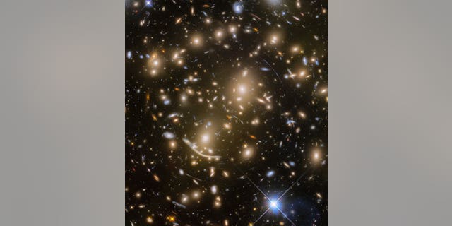 This new Hubble view features a distant galaxy cluster called Abell 370. It also captures numerous cosmic objects that are magnified by the powerful gravitational force of the galaxy cluster.