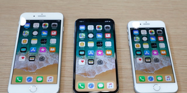 (L-R) iPhone 8 Plus, iPhone X and iPhone 8 models are displayed during an Apple launch event in Cupertino, California, U.S. Sept. 12, 2017. (REUTERS/Stephen Lam)