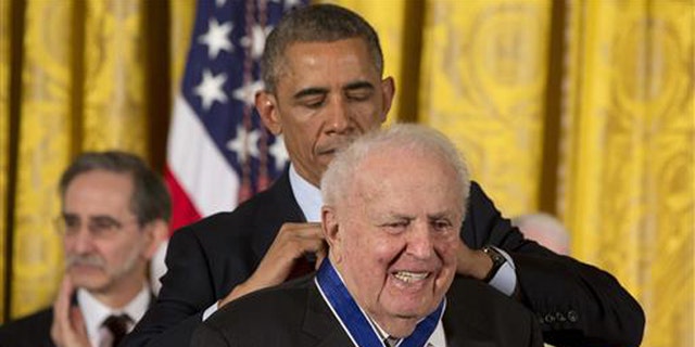 In this Nov. 24, 2014, file photo, President Barack Obama awards former Illinois Rep. Abner Mikva the Presidential Medal of Freedom during a ceremony in the East Room of the White House in Washington.