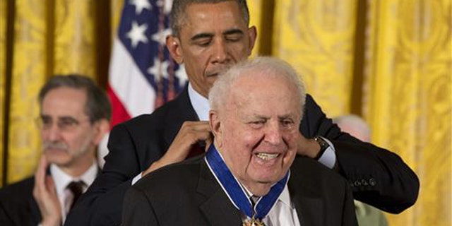 In this Nov. 24, 2014, file photo, President Barack Obama awards former Illinois Rep. Abner Mikva the Presidential Medal of Freedom during a ceremony in the East Room of the White House in Washington.