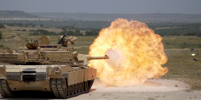 File photo - FORT HOOD, Tx--A Sabot round is fired from an M1A2 Abrams tank during 3rd Armored Brigade, 1st Cavalry Division gunnery qualification.