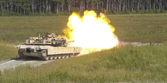 Marines fire an M1A1 Abrams tank during a gunnery range at Camp Lejeune, N.C., Sept. 19, 2017.