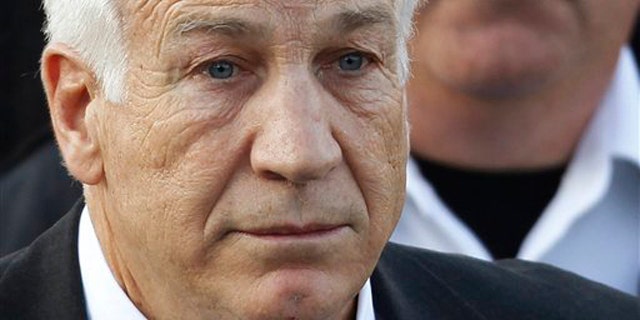 December 13, 2011: Jerry Sandusky, the former Penn State assistant football coach charged with sexually abusing boys, leaves the Centre County Courthouse in Bellefonte, Pa.